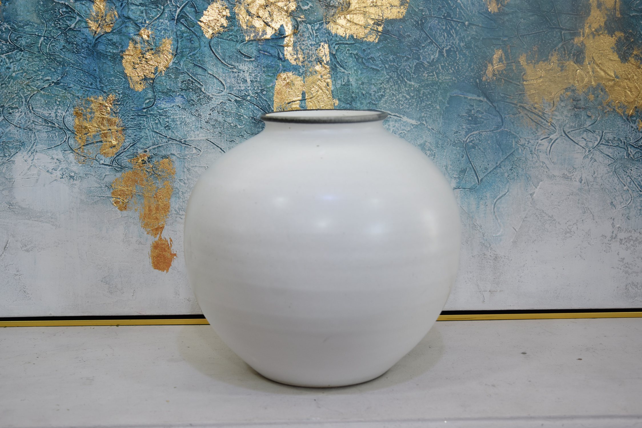 Round white pottery vase