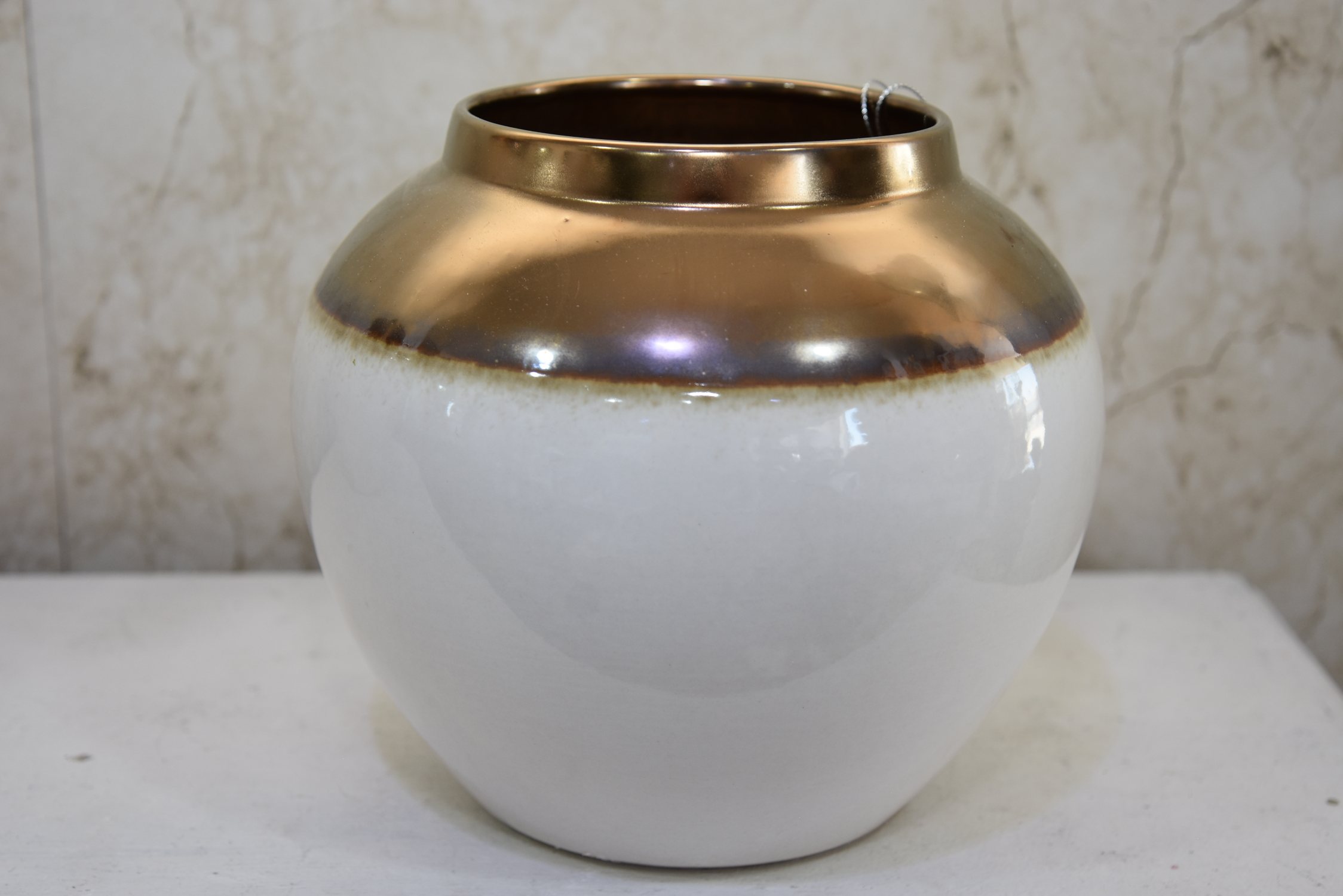 White pottery round vase